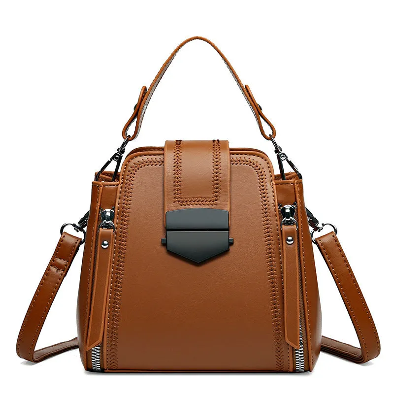Small square vertical handbag in soft textured PU leather with zip closure and sewing thread detail