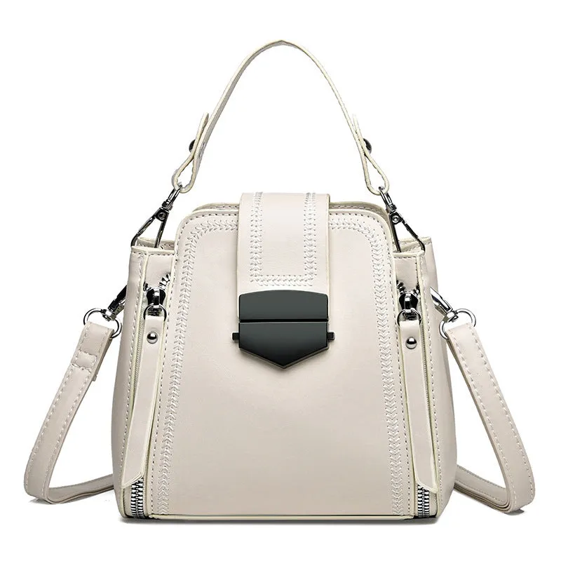 Small square vertical handbag in soft textured PU leather with zip closure and sewing thread detail