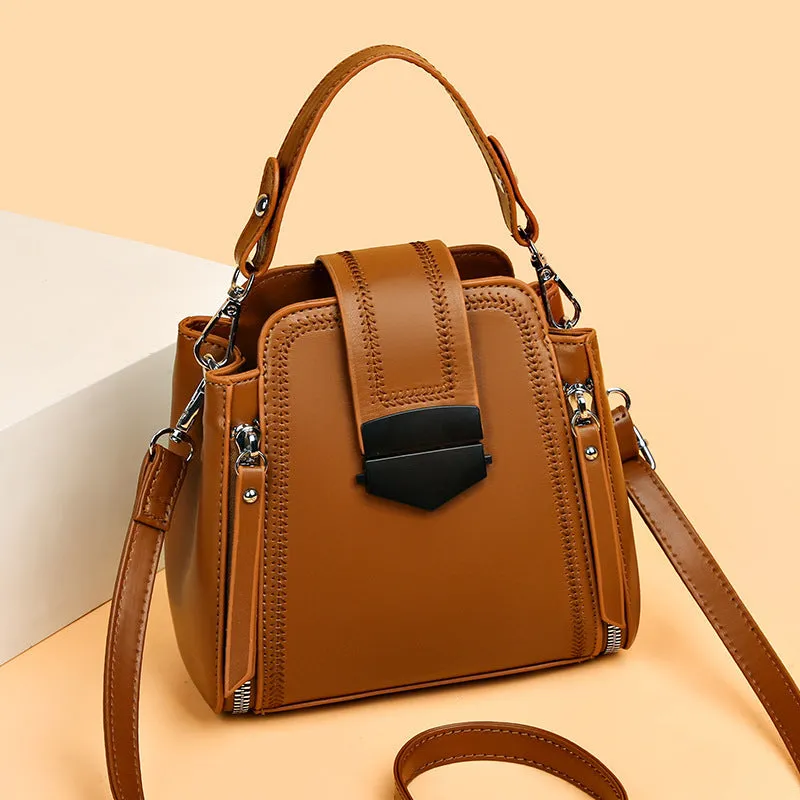 Small square vertical handbag in soft textured PU leather with zip closure and sewing thread detail