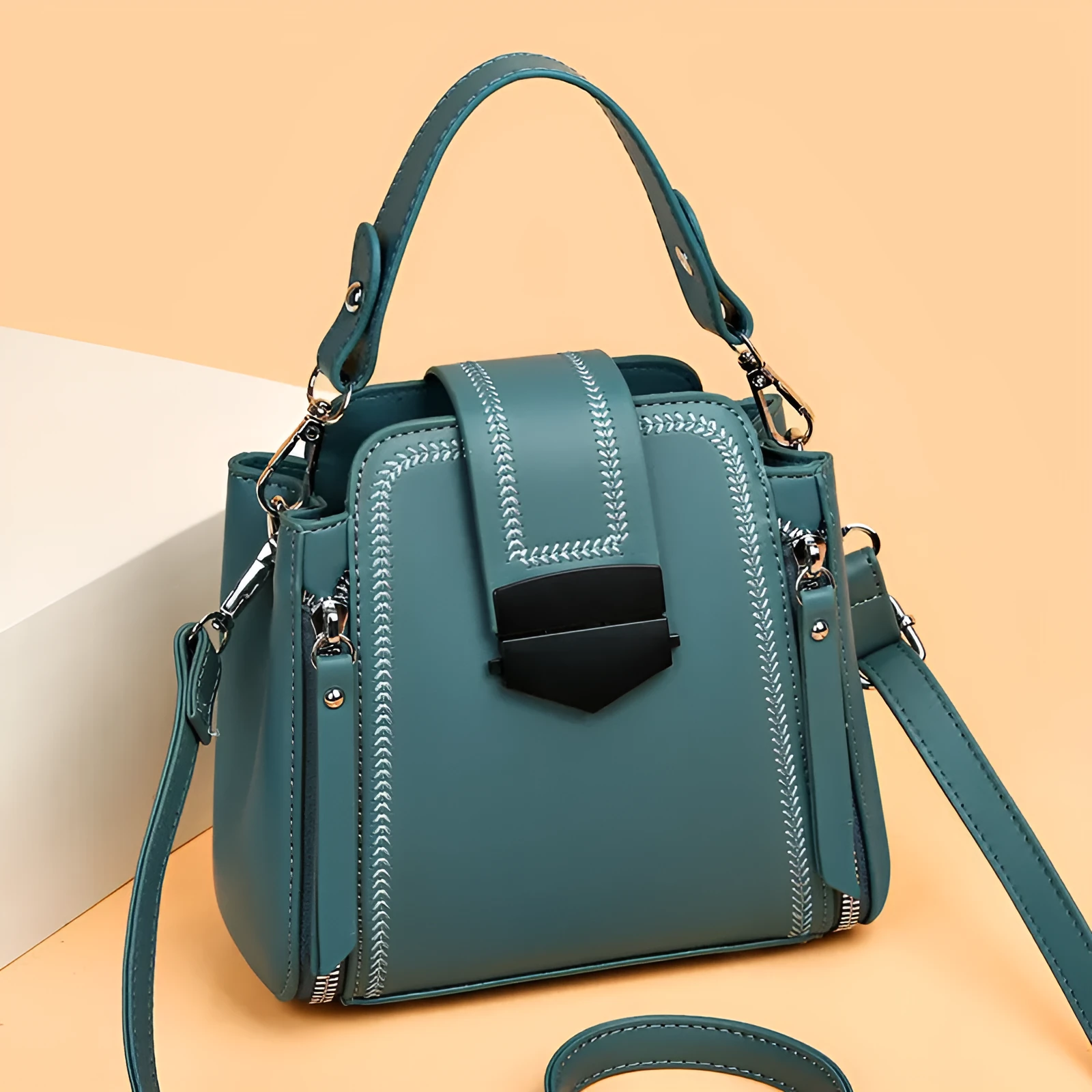 Small square vertical handbag in soft textured PU leather with zip closure and sewing thread detail