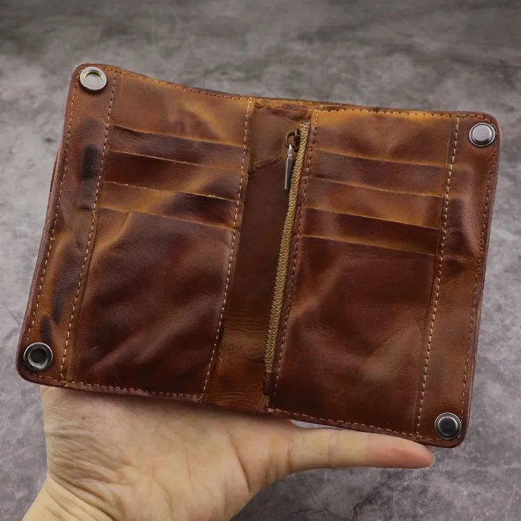 Men's brown leather bifold wallet open showing multiple card slots and coin pocket