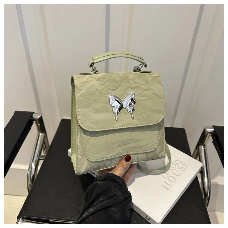 Women's preppy style PU hand-carry backpack with bow detail in light blue colour