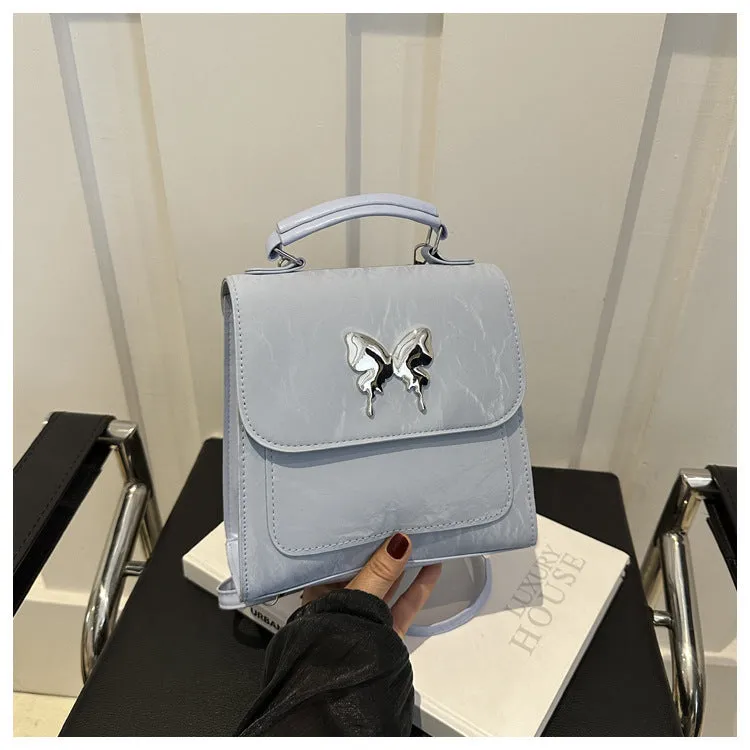 Women's preppy style PU hand-carry backpack with bow detail in light blue colour