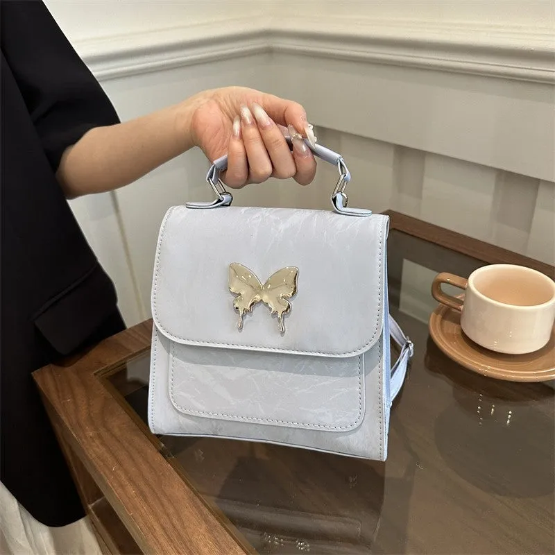 Women's preppy style PU hand-carry backpack with bow detail in light blue colour
