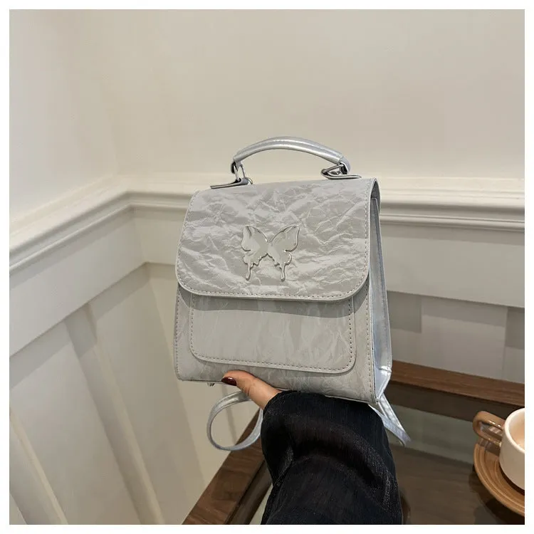 Women's preppy style PU hand-carry backpack with bow detail in light blue colour