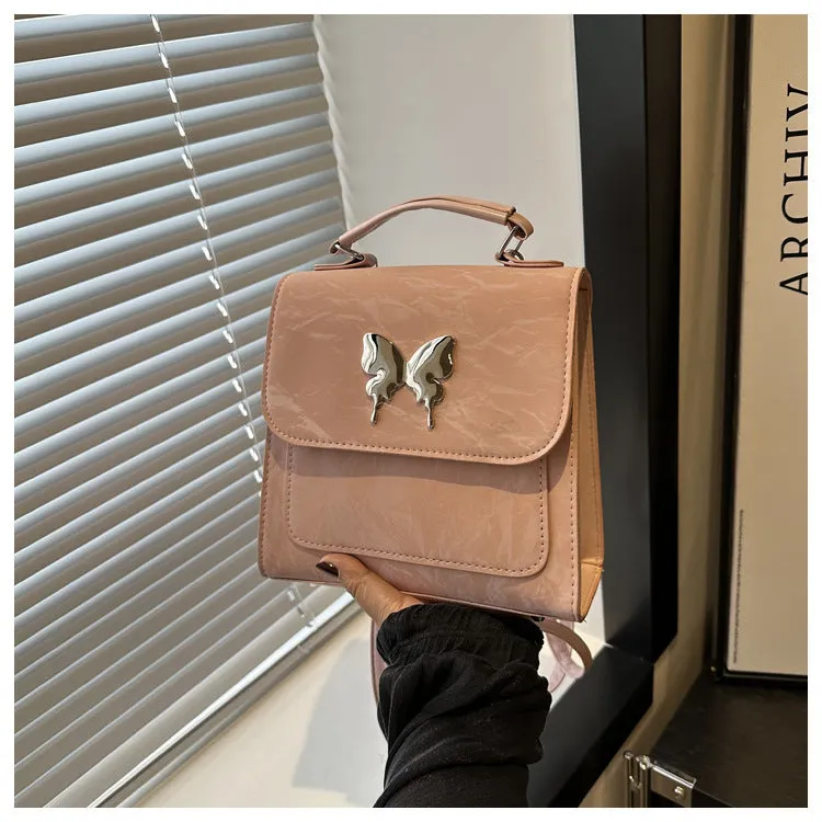 Women's preppy style PU hand-carry backpack with bow detail in light blue colour