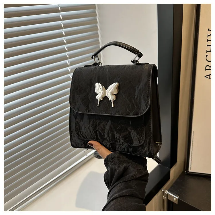 Women's preppy style PU hand-carry backpack with bow detail in light blue colour