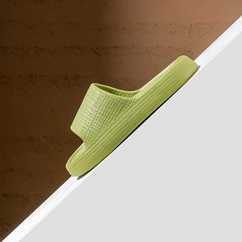 A pair of khaki coloured EVA toe ring slippers with a soft non-slip sole, shown on a white background.
