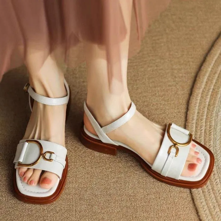 Women's beige leather sandals with a thick rubber sole and silver buckle fastening