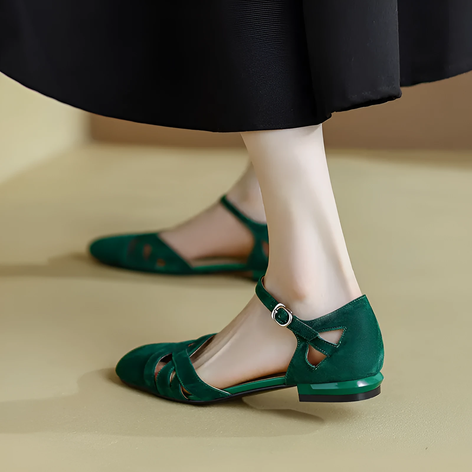 Apricot coloured classic Roman sandals with a buckle fastening and round toe on a rubber sole.