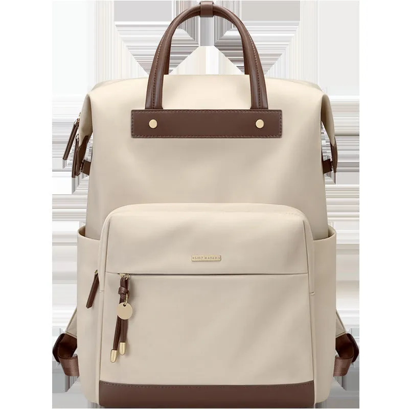 Large apricot coloured backpack with adjustable straps on a grey background