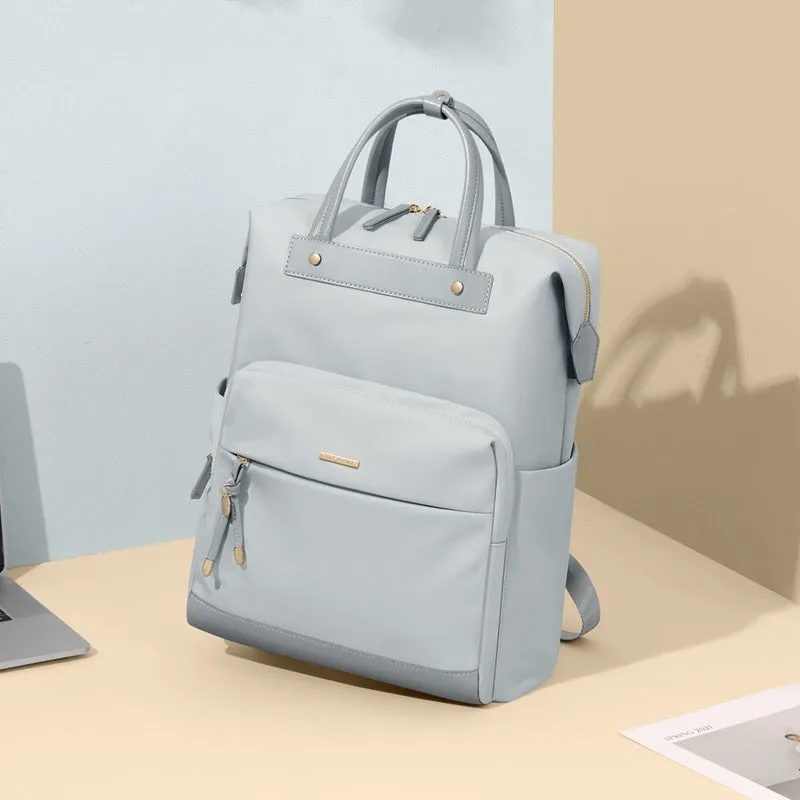 Large apricot coloured backpack with adjustable straps on a grey background