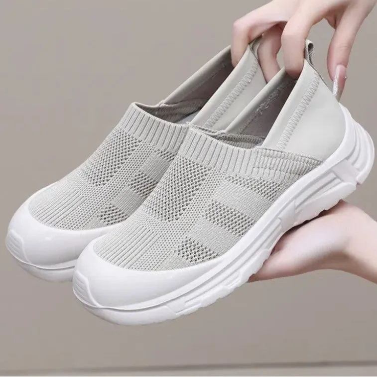 Women's black slip-on cloth shoes with round toe and soft PVC flat sole.