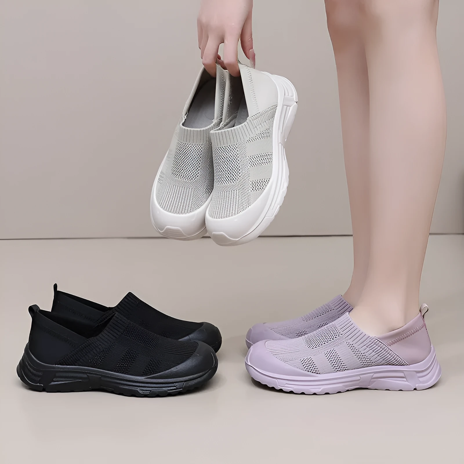 Women's black slip-on cloth shoes with round toe and soft PVC flat sole.