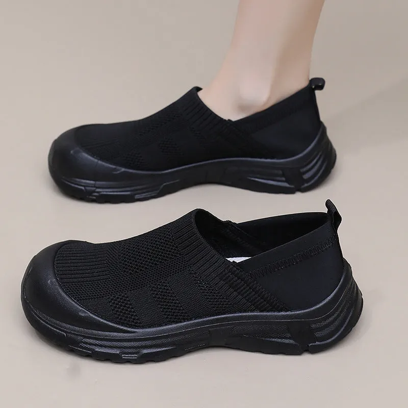 Women's black slip-on cloth shoes with round toe and soft PVC flat sole.