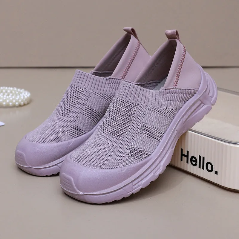 Women's black slip-on cloth shoes with round toe and soft PVC flat sole.