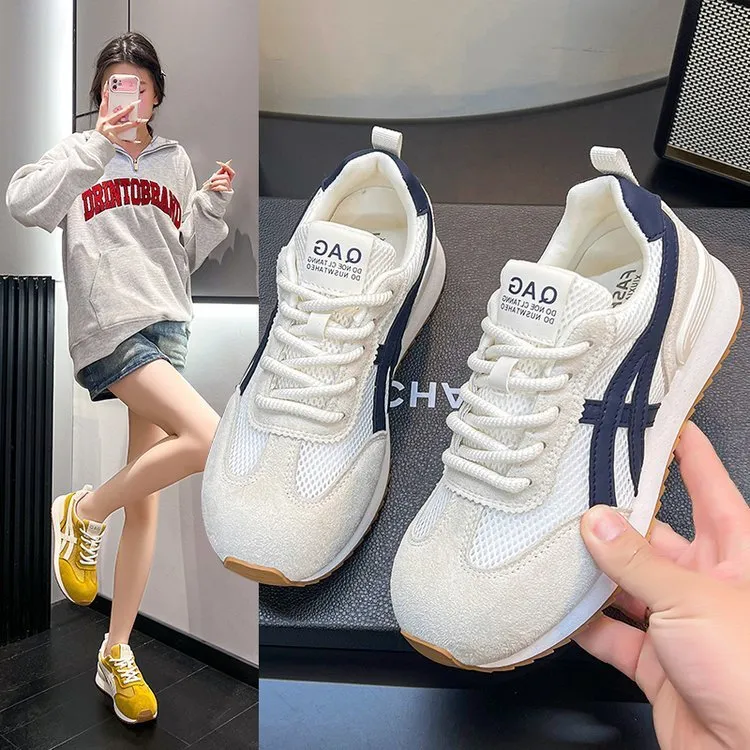 Women's white lace-up casual sneaker with round toe and flat non-slip sole.