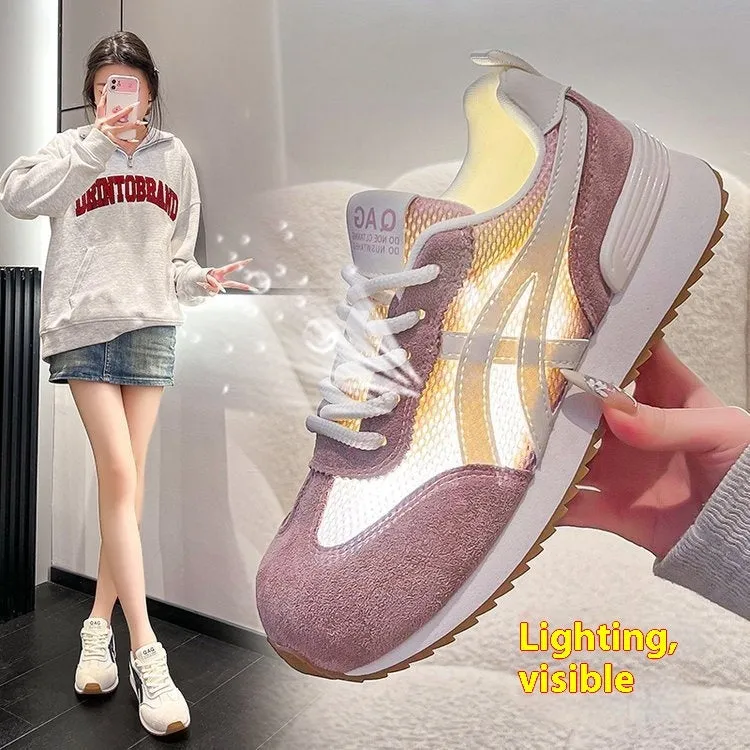 Women's white lace-up casual sneaker with round toe and flat non-slip sole.
