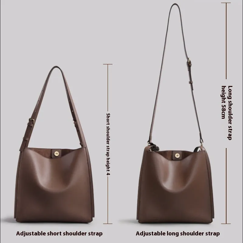 Brown genuine leather retro-style women's commuter bag with dual shoulder straps and external slit pocket.