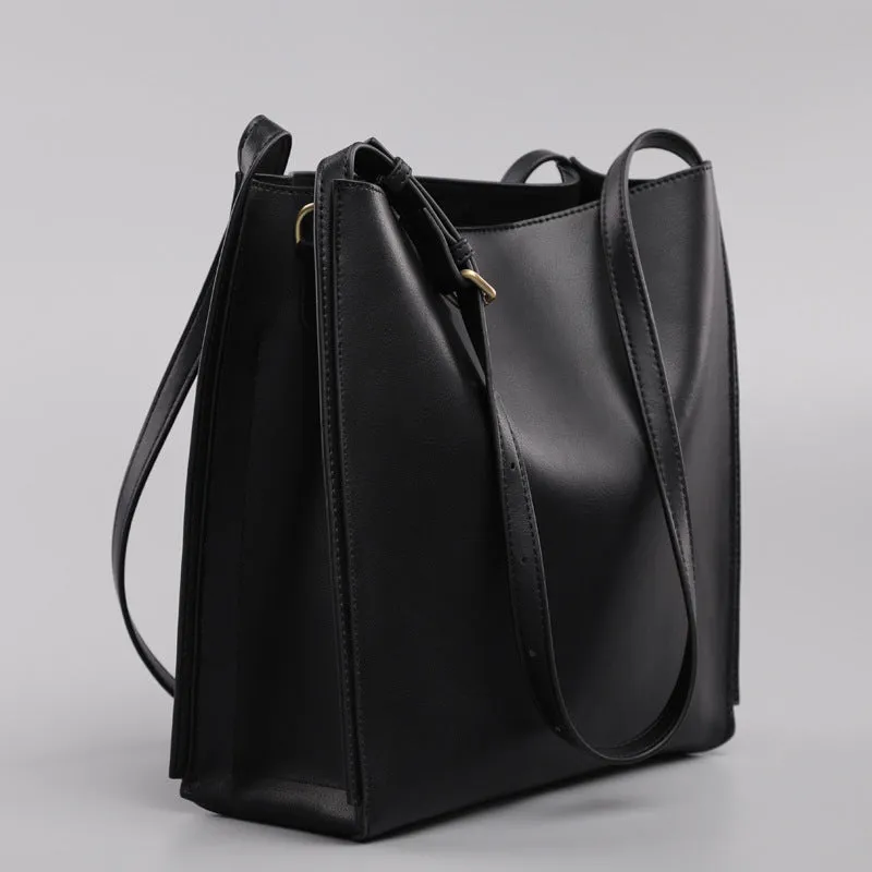 Brown genuine leather retro-style women's commuter bag with dual shoulder straps and external slit pocket.