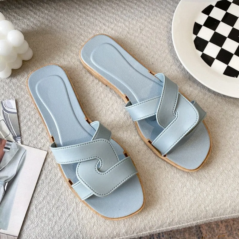 Women's PVC cross-strap sandals with toe ring design and non-slip soles in light blue colour