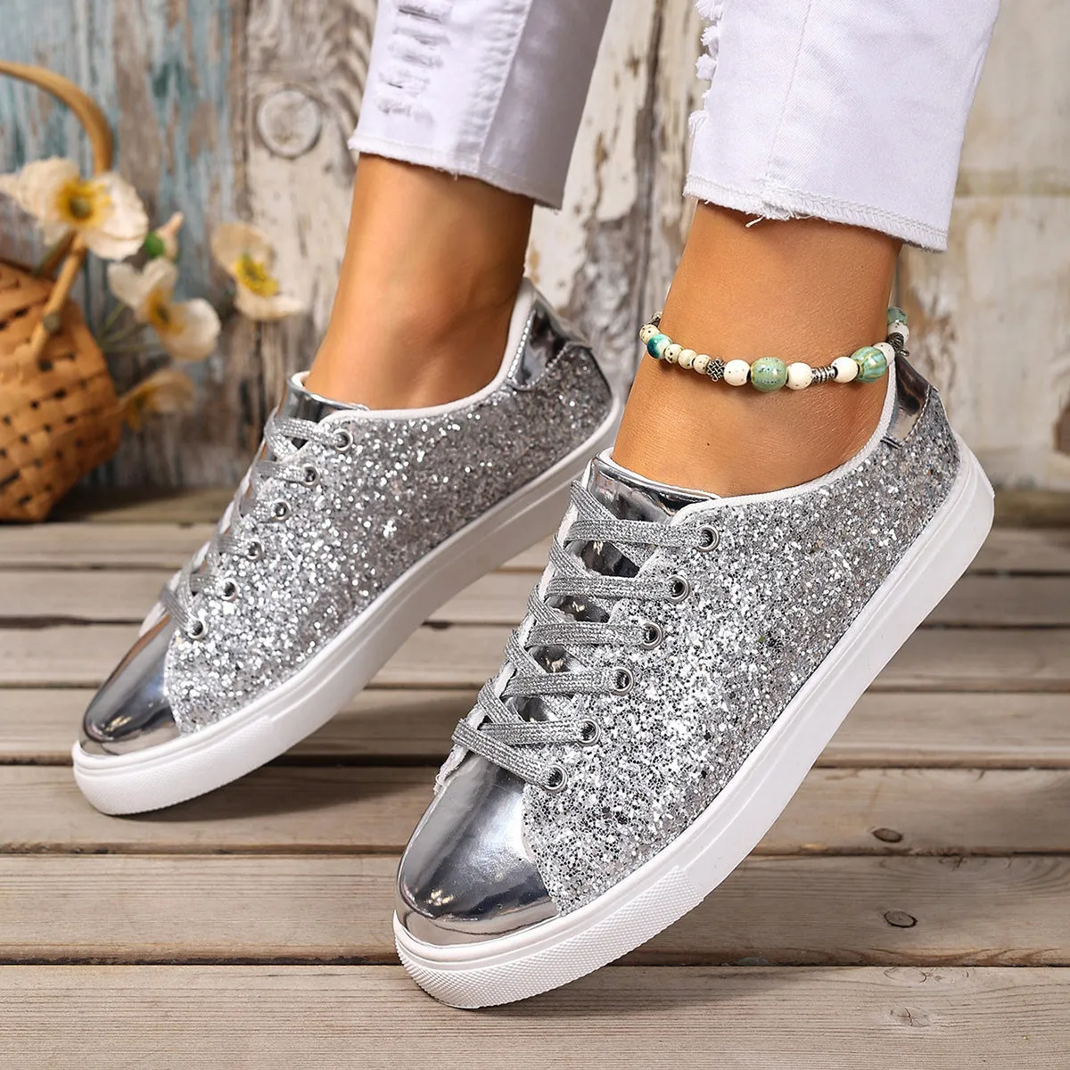 Women's plus size black sequin lace-up flat board shoes on a plain background
