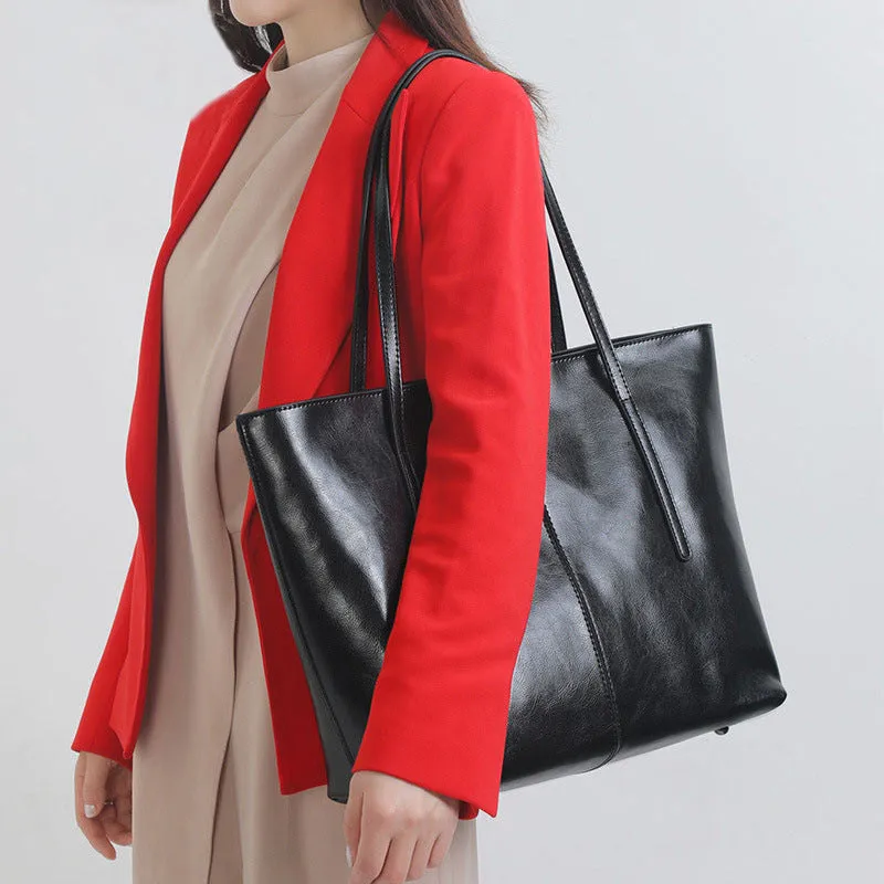 Women's retro style cowhide shoulder bag in horizontal square shape with multiple internal compartments