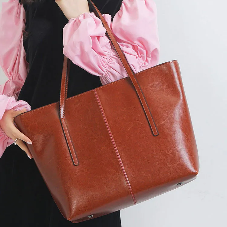 Women's retro style cowhide shoulder bag in horizontal square shape with multiple internal compartments