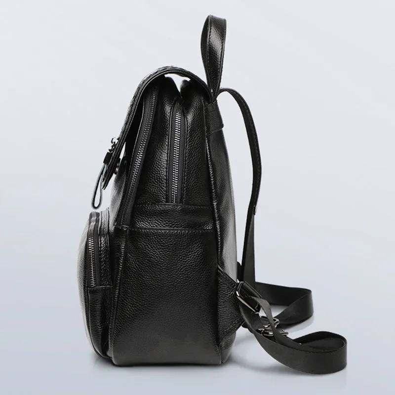 Genuine leather blue women's backpack showing front sandwich pocket and street trend design.