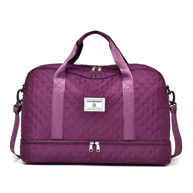 Large oxford cloth travel bag in a solid colour with visible sewing thread details, shown with the main compartment open.