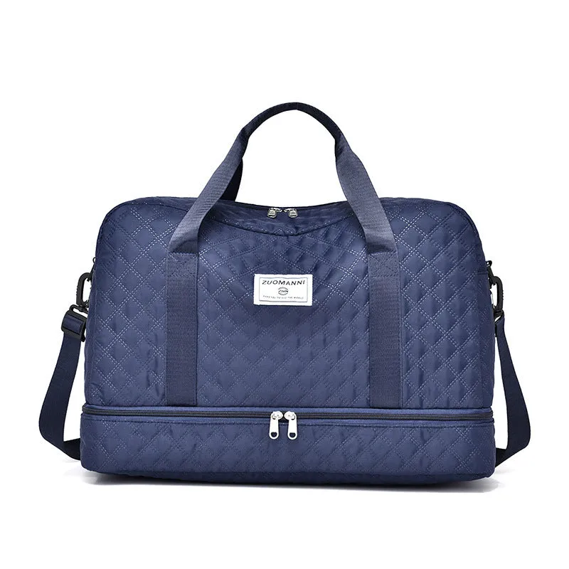 Large oxford cloth travel bag in a solid colour with visible sewing thread details, shown with the main compartment open.
