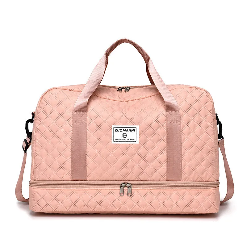 Large oxford cloth travel bag in a solid colour with visible sewing thread details, shown with the main compartment open.