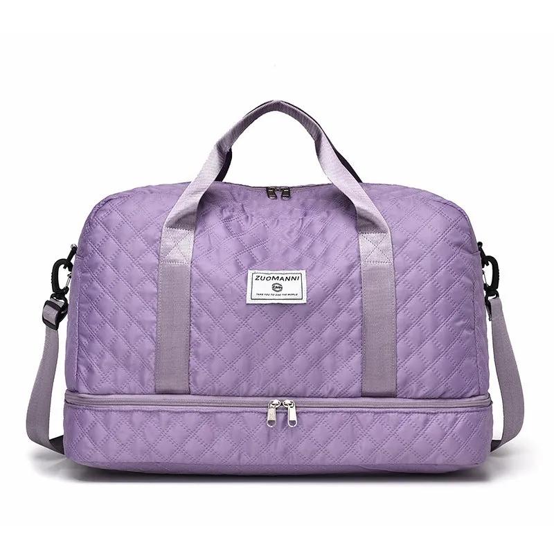 Large oxford cloth travel bag in a solid colour with visible sewing thread details, shown with the main compartment open.
