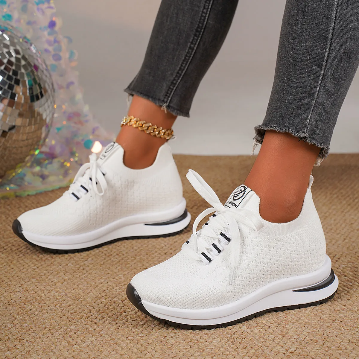 Women's black and white mesh platform sneakers with lace-up front and rubber sole