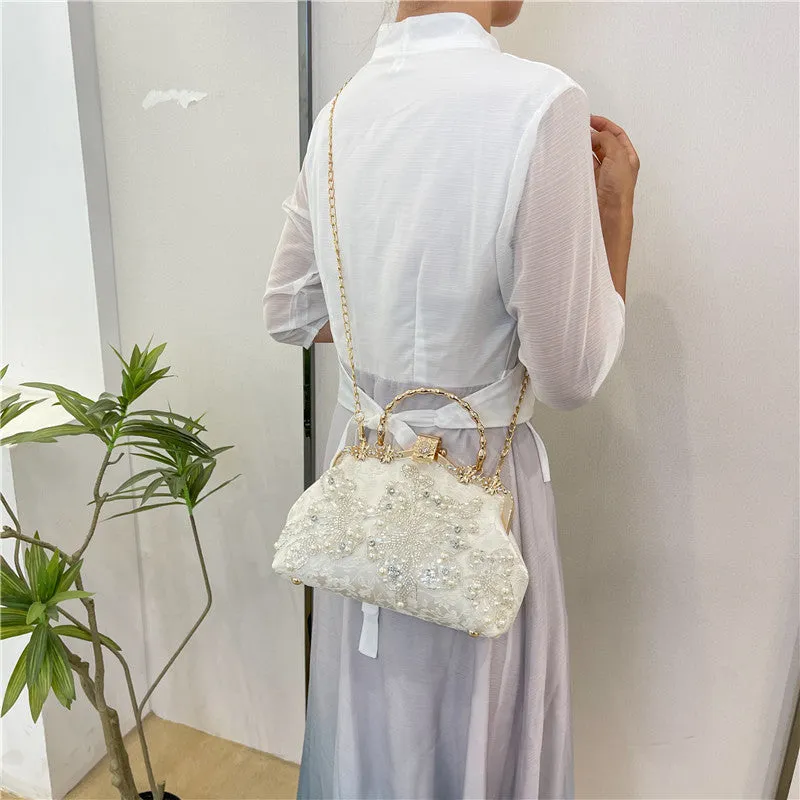 Pearl embroidered polyester handbag in horizontal square shape with double shoulder straps