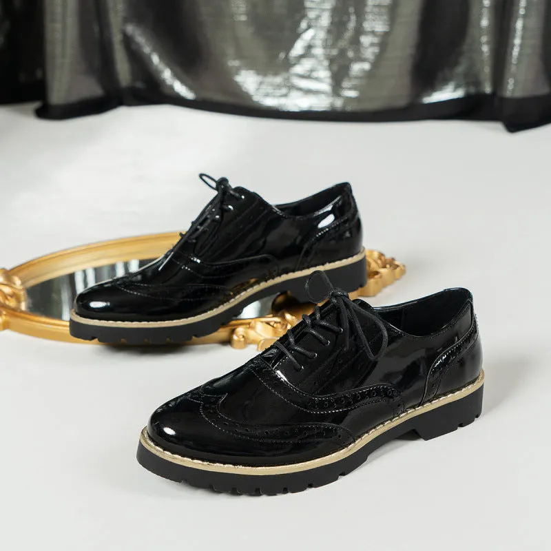 Women's black lace-up loafers with wedge heel and sequin details on the upper.