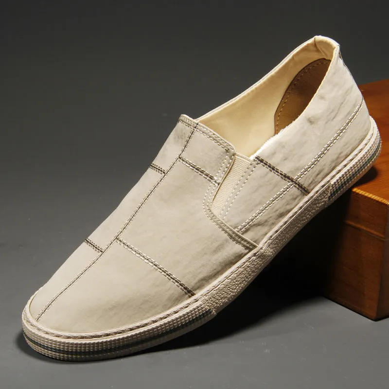Men's slip-on canvas shoes in various colours showing round toe and low-top design