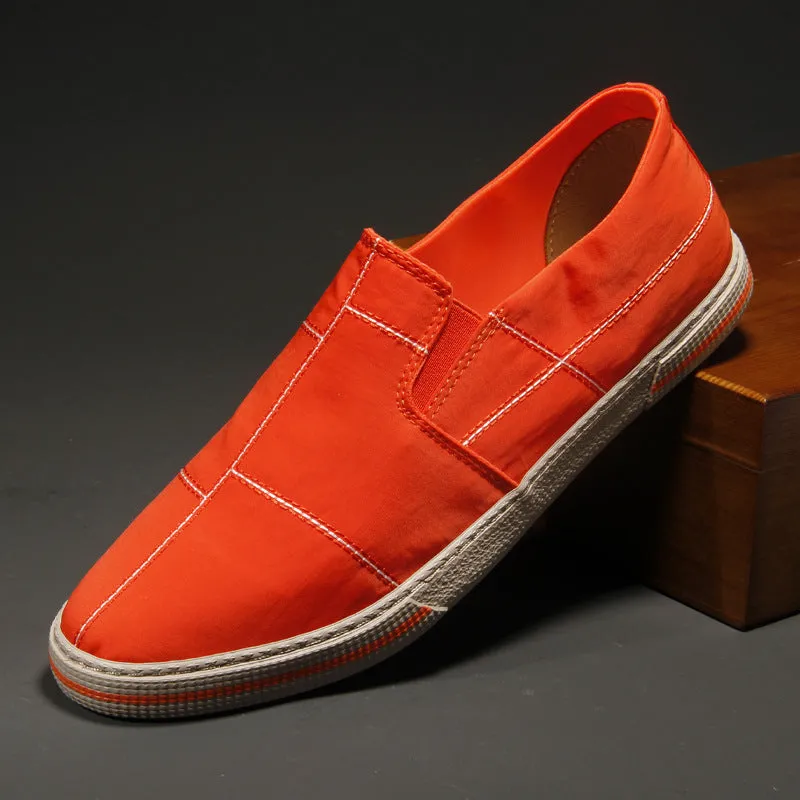 Men's slip-on canvas shoes in various colours showing round toe and low-top design