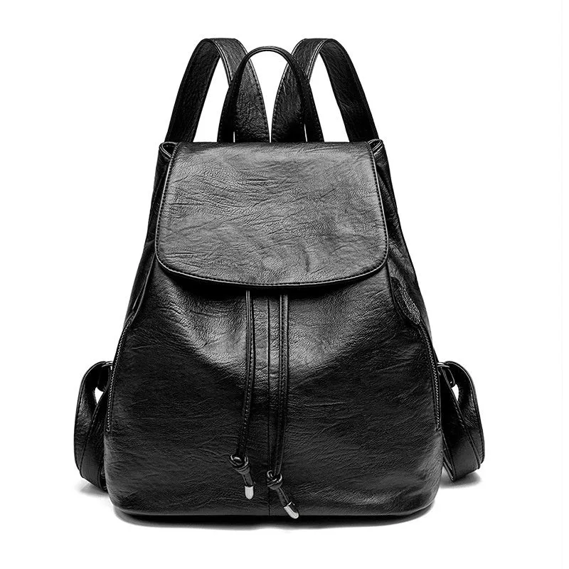 Black genuine leather women's backpack with multiple compartments and waterproof design