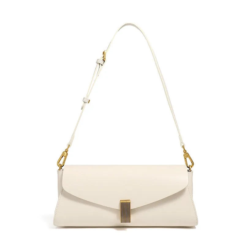 Women's leather cross-body bag with clamshell opening in milky white colour showing pillow-shaped design