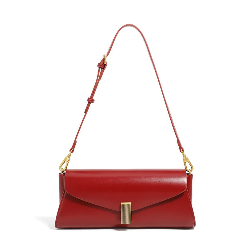 Women's leather cross-body bag with clamshell opening in milky white colour showing pillow-shaped design