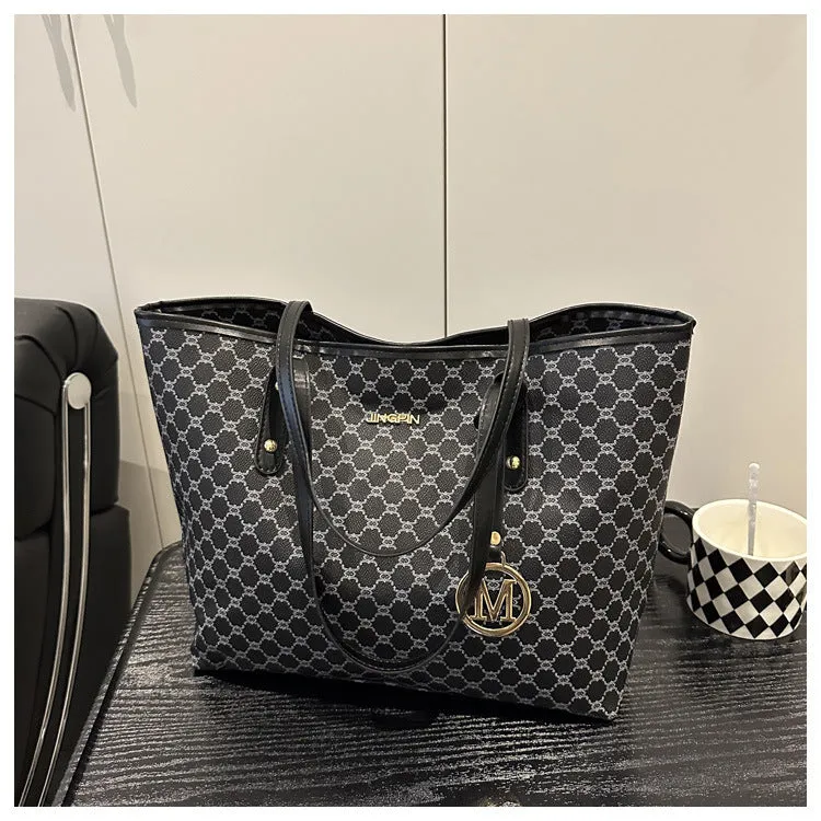 Western style textured PU shoulder bag in black, shown with contrast stitching and an adjustable strap.