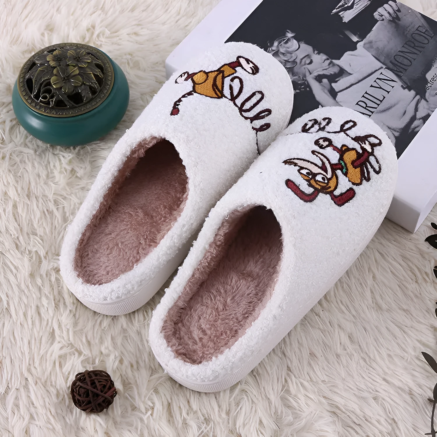 White plush non-slip slippers with artificial wool lining and rubber sole.