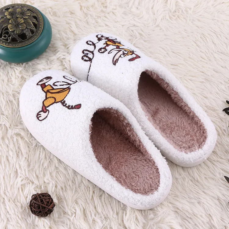 White plush non-slip slippers with artificial wool lining and rubber sole.