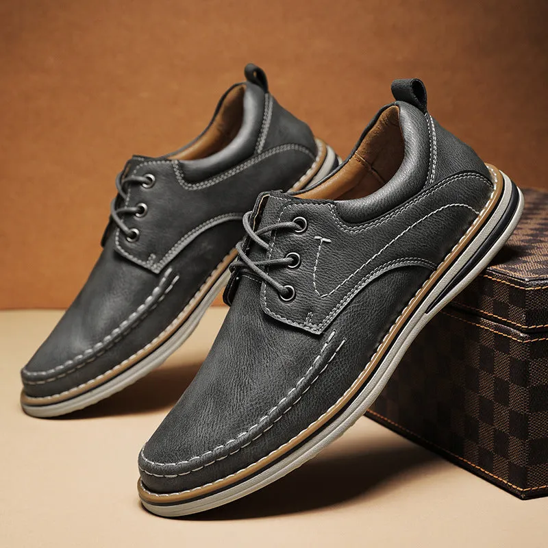 Men's black genuine leather lace-up casual shoes with round toe and low rubber sole on a white background.