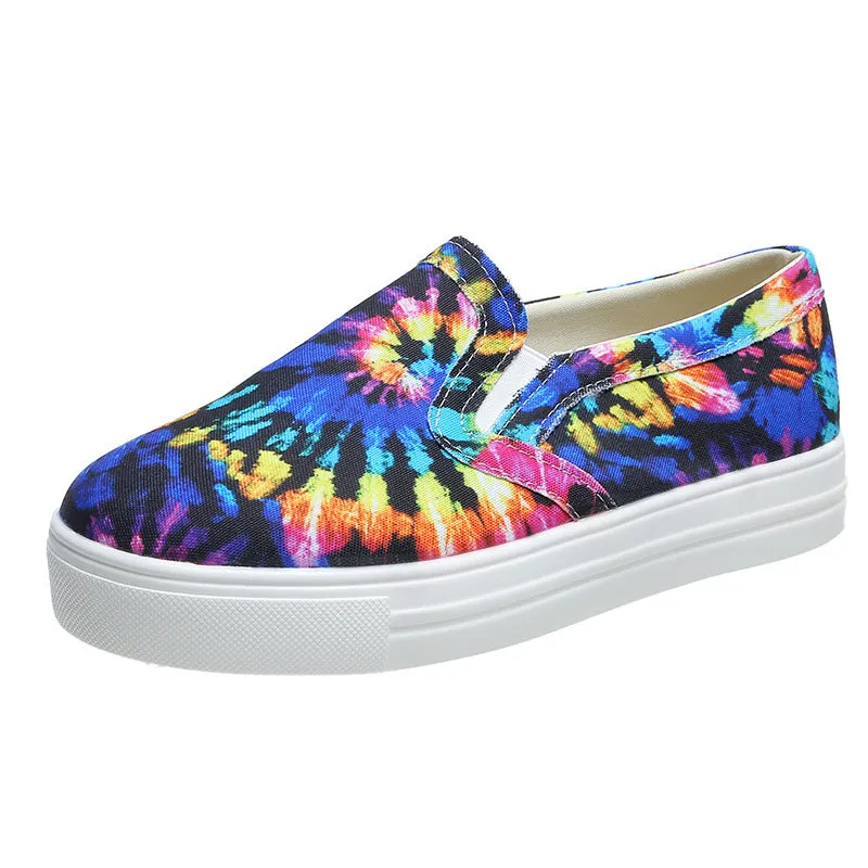 Women's low-top canvas slip-on shoes in colour matching pattern with rubber sole.