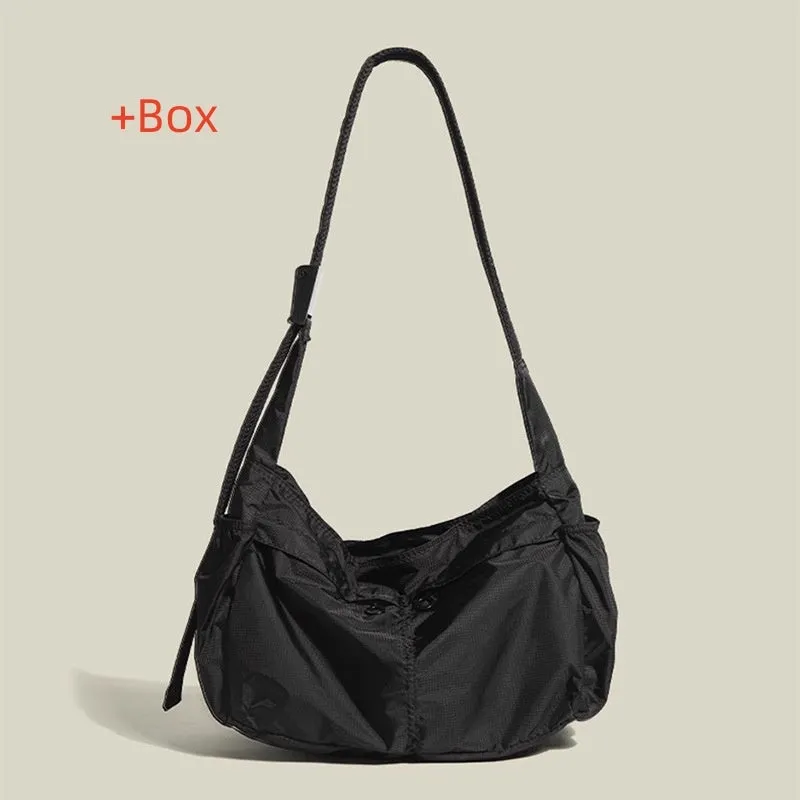 Black nylon waterproof sports style messenger bag with horizontal square design and shoulder strap