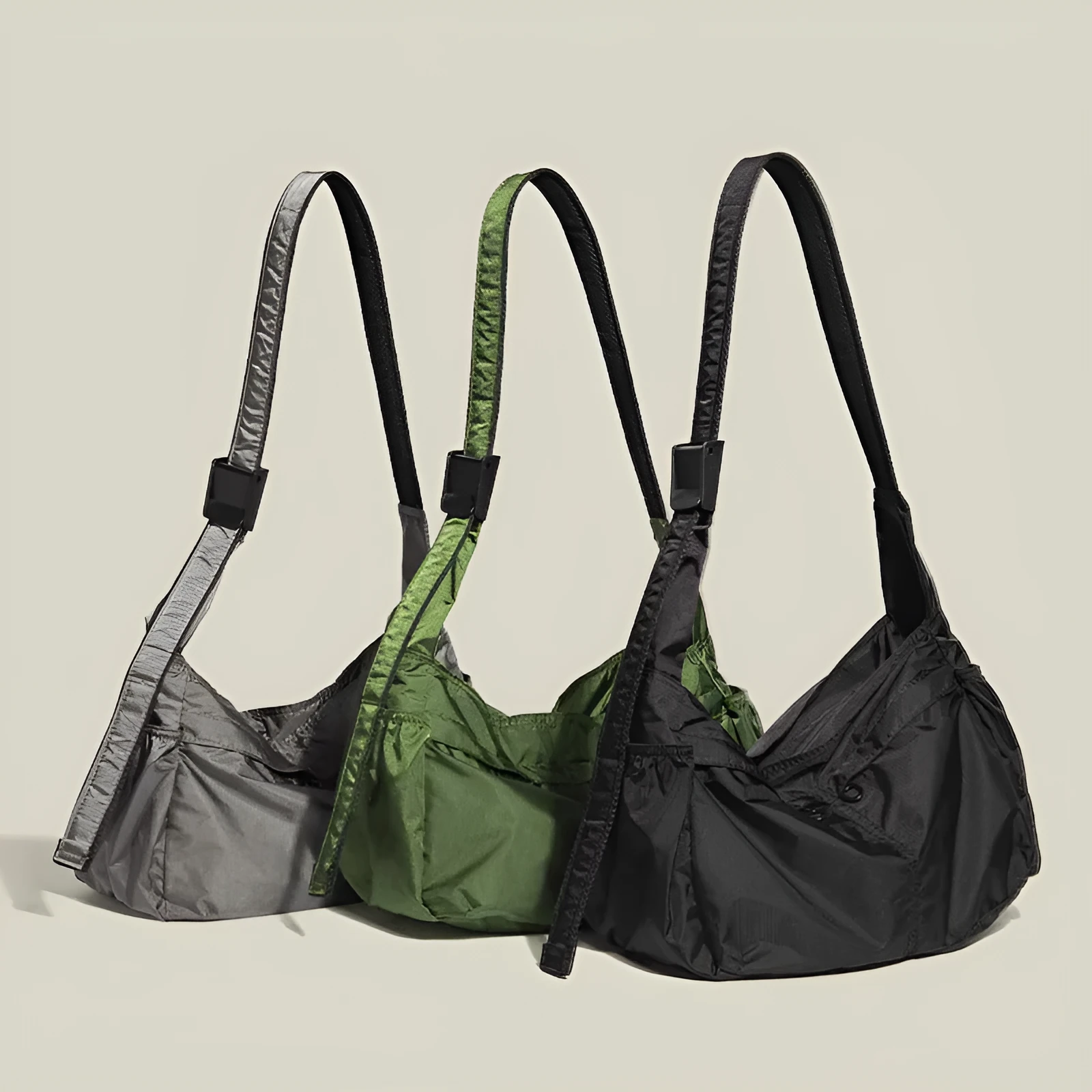 Black nylon waterproof sports style messenger bag with horizontal square design and shoulder strap