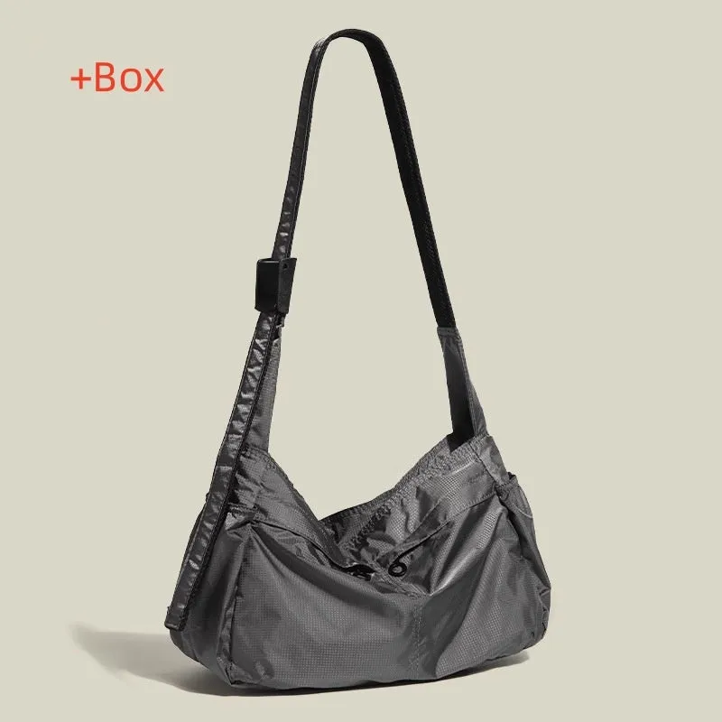 Black nylon waterproof sports style messenger bag with horizontal square design and shoulder strap