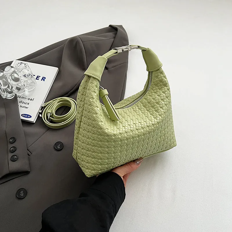 Soft PU leather messenger bag in bucket shape with internal document compartment, shown in a choice of colours.